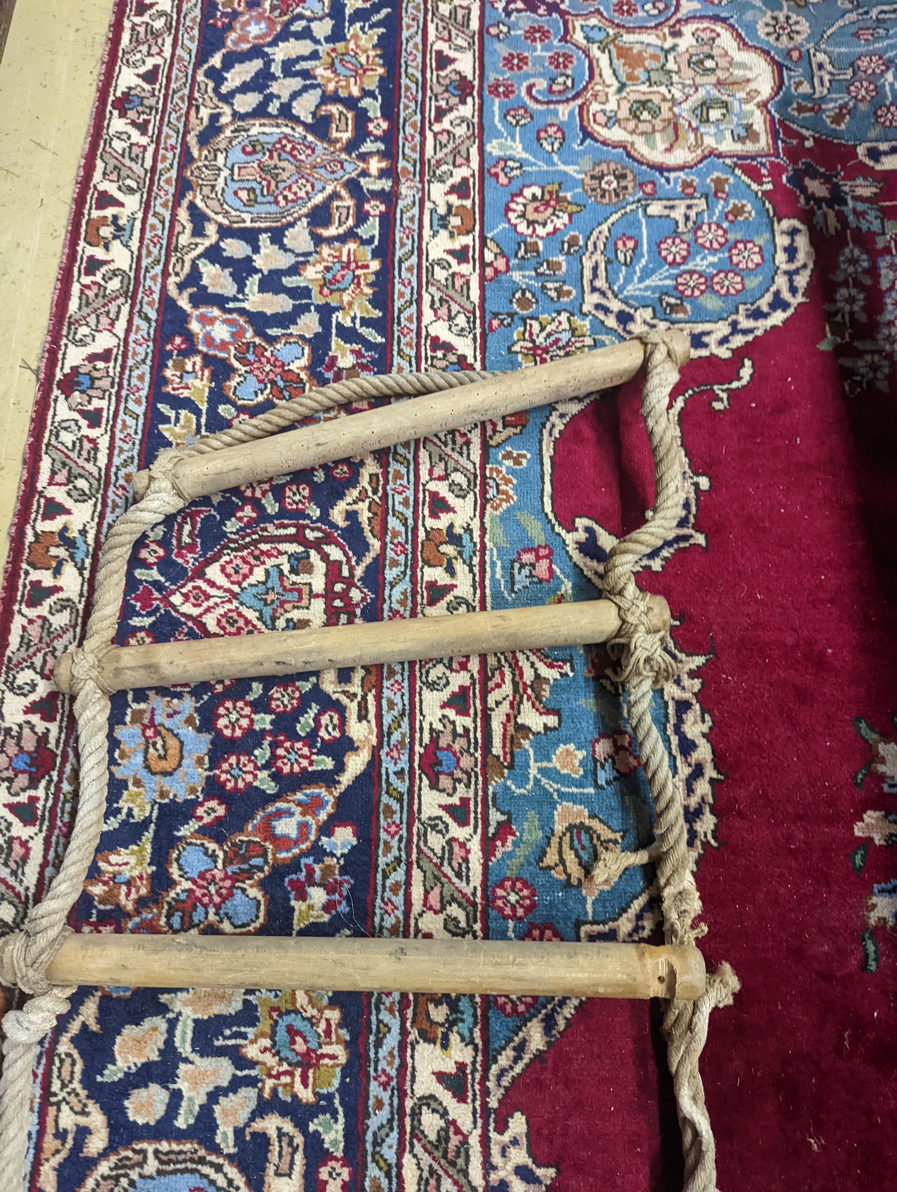 A rope ladder, Length 3.9 meters. (1 lower rung damaged)
